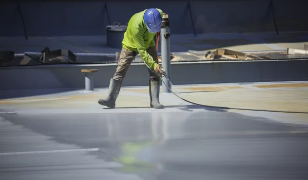 male-worker-holding-industrial-spray-gun-used-roof-plate-tank-surface-steel-industrial-painting-coating