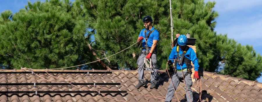 two-men-installing-solar-panels-on-a-house-2026-03-16-05-05-31-utc